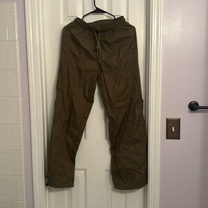 Dark green parachute pants, adjustable ankle and waist, size 2